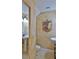 Small powder room features stylish wall decor, pedestal sink and tile floors at 1 Fox Hollow Dr, Ormond Beach, FL 32174
