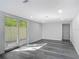 Bright living room with sliding door access to outdoor area and modern flooring at 102 Judges Ln, Port Orange, FL 32129