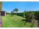 Sprawling backyard featuring lush green grass and mature trees for privacy at 1088 Avery Meadows Way, Deland, FL 32724