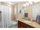 Bright bathroom with a granite countertop, bathtub, shower and white curtain at 1088 Avery Meadows Way, Deland, FL 32724