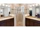 Bathroom showcasing dual vanities, a large walk-in shower, and modern fixtures at 1088 Avery Meadows Way, Deland, FL 32724