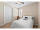 Bedroom with light hardwood floors, window with shutters, and ceiling fan at 1088 Avery Meadows Way, Deland, FL 32724