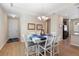 Elegant dining area with a chandelier, seating for six, and access to the kitchen at 1088 Avery Meadows Way, Deland, FL 32724