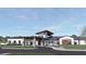 Modern building with a portico, well-manicured landscaping, and a circular driveway at 1088 Avery Meadows Way, Deland, FL 32724