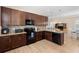 Beautiful kitchen with wooden cabinets and an adjacent dining area at 1088 Avery Meadows Way, Deland, FL 32724