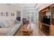Bright living room featuring a comfortable sofa and entertainment center at 1088 Avery Meadows Way, Deland, FL 32724