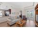 Comfortable living room with an open floor plan and access to the outdoor space at 1088 Avery Meadows Way, Deland, FL 32724