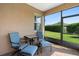 Enclosed patio with comfortable seating, brick floors and screened windows at 1088 Avery Meadows Way, Deland, FL 32724
