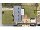 An aerial view shows the backyard's layout, including the deck, seating, and shed at 111 Claire Ter, Daytona Beach, FL 32118