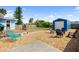Backyard featuring a detached garage, grill and deck for outdoor entertaining at 111 Claire Ter, Daytona Beach, FL 32118