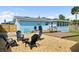 The backyard features outdoor seating, a grill, and a wooden deck great for gatherings at 111 Claire Ter, Daytona Beach, FL 32118