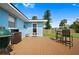 The backyard deck features a grill, seating, and plenty of space for outdoor dining at 111 Claire Ter, Daytona Beach, FL 32118