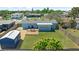 Aerial view of a home with a large fenced backyard, wooden deck, storage shed, and plenty of green space at 111 Claire Ter, Daytona Beach, FL 32118