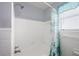 Bright bathroom featuring a white tiled shower and nautical themed curtain at 111 Claire Ter, Daytona Beach, FL 32118