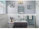 Nautical themed bathroom showcasing vanity, tiled walls, and decorative elements at 111 Claire Ter, Daytona Beach, FL 32118