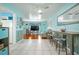 Bright kitchen area with an open view of the living spaces, featuring white cabinets and modern appliances at 111 Claire Ter, Daytona Beach, FL 32118