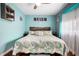 Comfortable main bedroom featuring wood floors, soft natural light, and stylish decor for a peaceful night's sleep at 111 Claire Ter, Daytona Beach, FL 32118