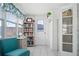 Relaxing sunroom with large windows, comfortable seating, a desk, and bookshelves; great for reading or working at 111 Claire Ter, Daytona Beach, FL 32118