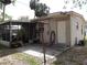 A back patio and screened in porch offer places to relax outside of the home at 1151 Deltona Blvd, Deltona, FL 32725