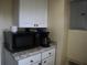 Kitchen featuring stainless microwave and countertop coffee maker at 1151 Deltona Blvd, Deltona, FL 32725