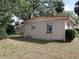 Home exterior, side view, showing windows and utilities at 1151 Deltona Blvd, Deltona, FL 32725