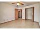 The bedroom has tile floors and closet, with ceiling fan and natural light at 1167 Peachtree Rd, Daytona Beach, FL 32114