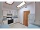 Bright kitchen with skylights, ample storage, and modern appliances at 1167 Peachtree Rd, Daytona Beach, FL 32114