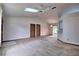 Open-concept living room with ceiling fan and view into dining area and patio at 1167 Peachtree Rd, Daytona Beach, FL 32114