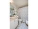 Bathroom featuring floral shower curtain, white tile floors, and sink at 120 Hibiscus Woods Ct # 2A, Deltona, FL 32725