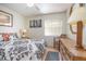 Comfortable bedroom features wood floors, accent wall art, and neutral tones at 120 Hibiscus Woods Ct # 2A, Deltona, FL 32725