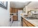 Functional kitchen with ample cabinet space and essential appliances at 120 Hibiscus Woods Ct # 2A, Deltona, FL 32725