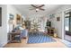 Bright living room features a ceiling fan, open floor plan, and a dining area at 120 Hibiscus Woods Ct # 2A, Deltona, FL 32725