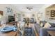 Comfortable living room showcases modern decor, ceiling fan, and dining area at 120 Hibiscus Woods Ct # 2A, Deltona, FL 32725
