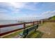 Enjoy serene views from this community space overlooking the water with seating at 120 Hibiscus Woods Ct # 2A, Deltona, FL 32725