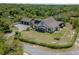 Expansive aerial view of the home, highlighting the lush landscaping and private surroundings at 125 Smyrna Dr, Debary, FL 32713