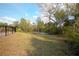 Large, fenced backyard with a trampoline and slide at 125 Smyrna Dr, Debary, FL 32713