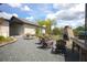 The backyard features a stone fireplace, outdoor seating, and gravel throughout at 125 Smyrna Dr, Debary, FL 32713