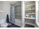 Bathroom with shower and shelves at 125 Smyrna Dr, Debary, FL 32713