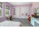 A room with polished concrete floors, purple walls, and two closets at 125 Smyrna Dr, Debary, FL 32713