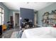 Bedroom with a white ceiling fan, light blue walls, and an eclectic decor at 125 Smyrna Dr, Debary, FL 32713