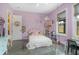Bedroom with pink walls, decorative items, and large window at 125 Smyrna Dr, Debary, FL 32713