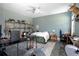 Bedroom with a white ceiling fan, light blue walls, and an eclectic decor at 125 Smyrna Dr, Debary, FL 32713
