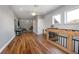 An upstairs bonus room with hardwood floors, a piano, comfortable seating, and lots of natural light at 125 Smyrna Dr, Debary, FL 32713