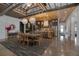 Bright dining area with modern light fixtures, open to a kitchen at 125 Smyrna Dr, Debary, FL 32713