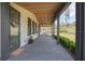 Welcoming front porch with stylish accents and brick flooring at 125 Smyrna Dr, Debary, FL 32713