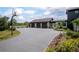 Spacious three-car garage with an extra-long driveway and basketball hoop, perfect for a Gathering at 125 Smyrna Dr, Debary, FL 32713