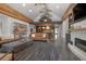 Open-concept living room with concrete floors, wood beams, and fireplace at 125 Smyrna Dr, Debary, FL 32713
