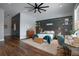 Bedroom with a ceiling fan, wooden floors and an ensuite bathroom at 125 Smyrna Dr, Debary, FL 32713