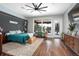Bright primary bedroom with a large window and wood floors at 125 Smyrna Dr, Debary, FL 32713