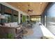 Spacious screened patio with comfortable seating, ceiling fans, and wooden ceiling at 125 Smyrna Dr, Debary, FL 32713